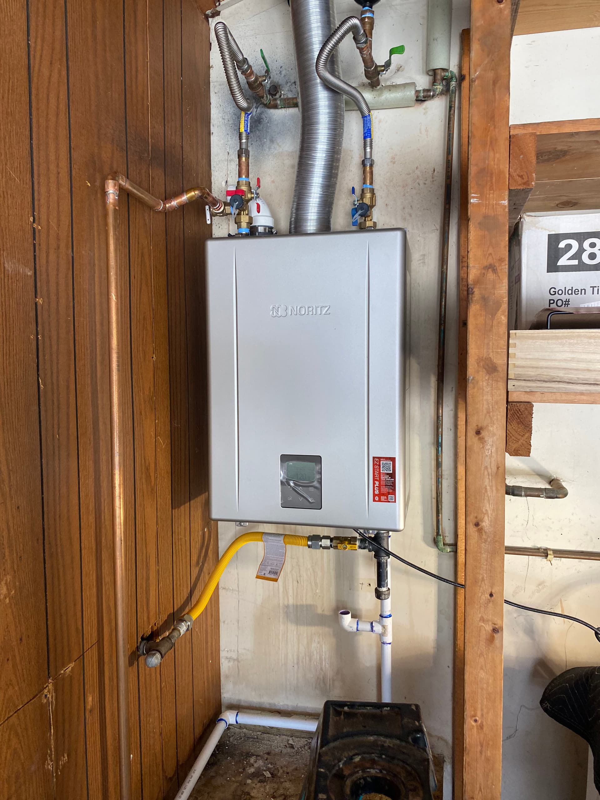 Old Leaking Water Heater Replaced With a New Noritz Tankless Unit image